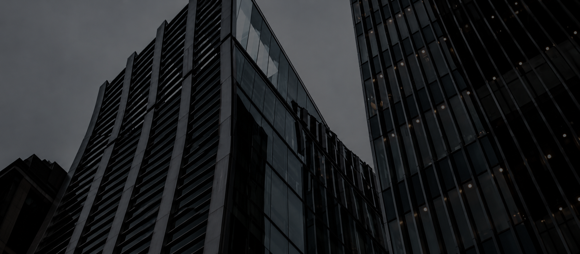 Modern glass office towers reaching upward